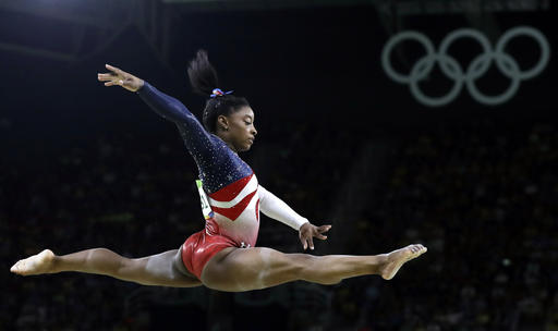 Simone Biles performs on the balance beam during the gymnastics women's team final at the Summer Olympics. Biles was selected as the AP Female Athlete of the Year on Monday. 
Associated Press/Rebecca Blackwell