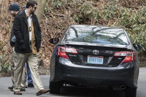 U.S. special agents check a car with diplomatic license plates outside the Russian estate in the village of Upper Brookville in the town of Oyster Bay, N.Y., on Long Island, Friday.