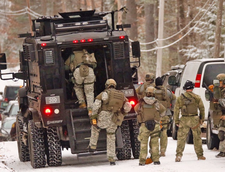The Cumberland County sheriff's SWAT unit prepares to move closer to the scene of a  standoff on Smith Mill Road in Standish Thursday morning. <em>Carl D. Walsh/Staff Photographer</em>