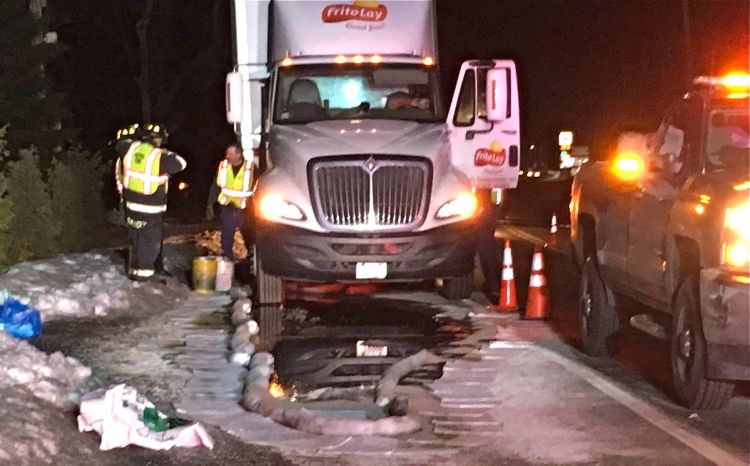 Emergency crews work at the scene Wednesday morning to mop up an diesel fuel spill on Route 26 in Oxford. <em>Photo courtesy of WCSH</em>