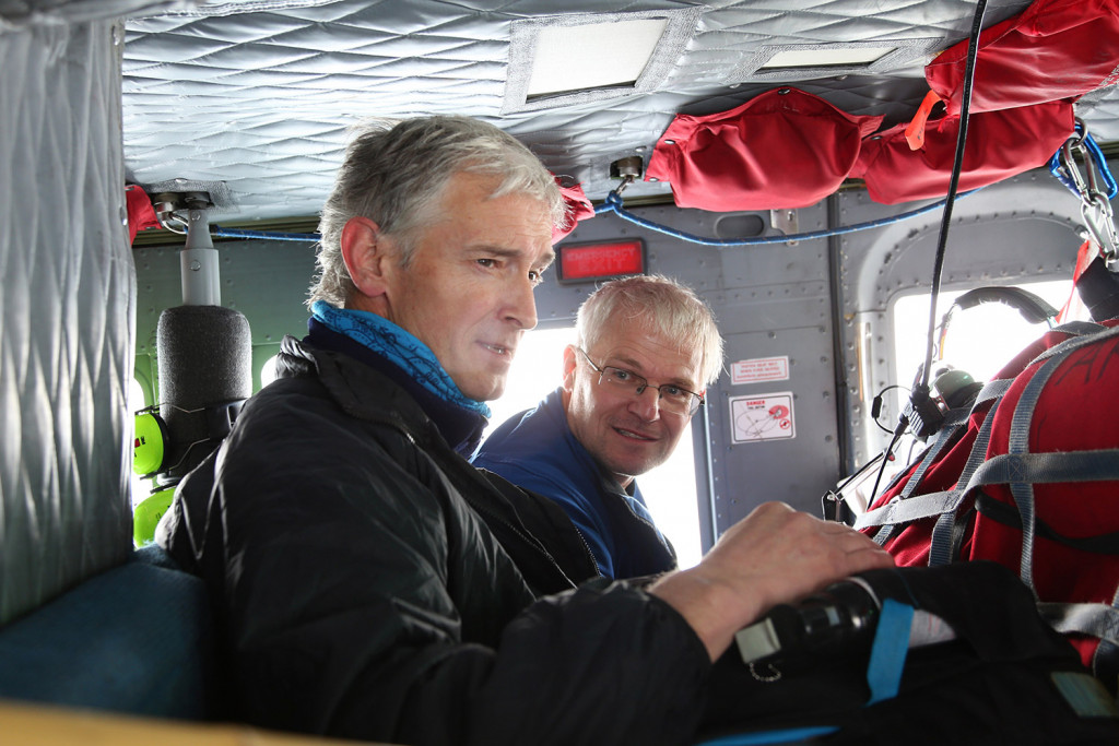 Keith Nicholls, left, and Andreas Muenchow look out of the helicopter to check the condition of equipment they had installed a year earlier.
