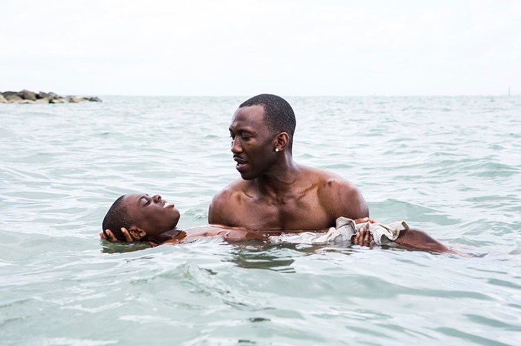 Alex Hibbert, foreground, and Mahershala Ali in a scene from the film, "Moonlight."