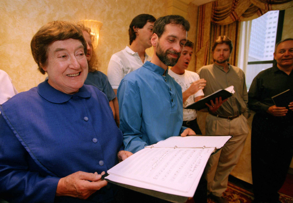Sister Frances Carr, left, and Brother Arnold Hadd of the Shaker Village in Sabbathday Lake, Maine, sing with the Boston Camerata during a rehearsal at New York's Warwick Hotel, Sept. 13, 1995. Shakers and the Camerata have a recording "Simple Gifts" of Shaker songs. It's the first time in their history that Shakers have recorded their own music. (AP Photo/Adam Nadel)