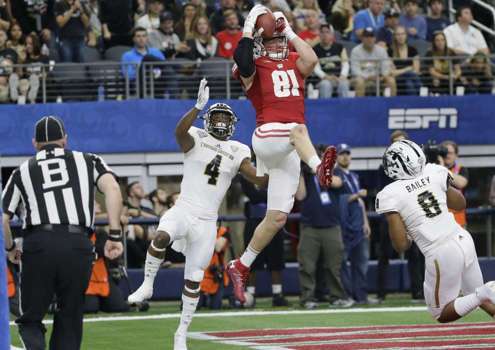 Wisconsin tight end Troy Fumagalli catches a touchdown pass between Western Michigan defenders Darius Phillips, left, and Caleb Bailey during the fourth quarter of Wisconsin's 24-16 Cotton Bowl win Monday at Arlington, Texas.
