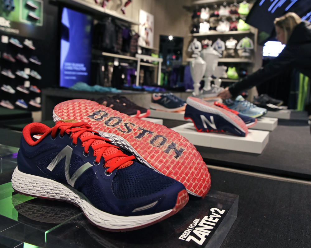 The word "Boston" accents the sole of the New Balance Zante v2 shoe on display at the company's headquarters in the Brighton neighborhood of Boston.