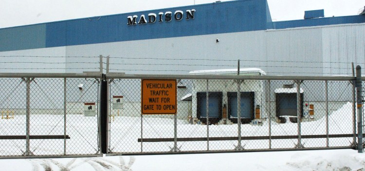 Gates are closed and locked Tuesday at the closed former Madison Paper Industries mill, where new owners hope to redevelop a portion of the property.