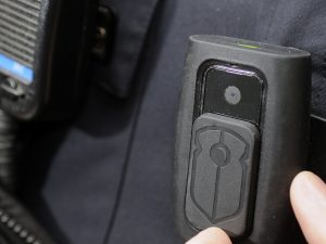 Body cameras are often attached to the lapel or chest area of police officers and record audio and video.