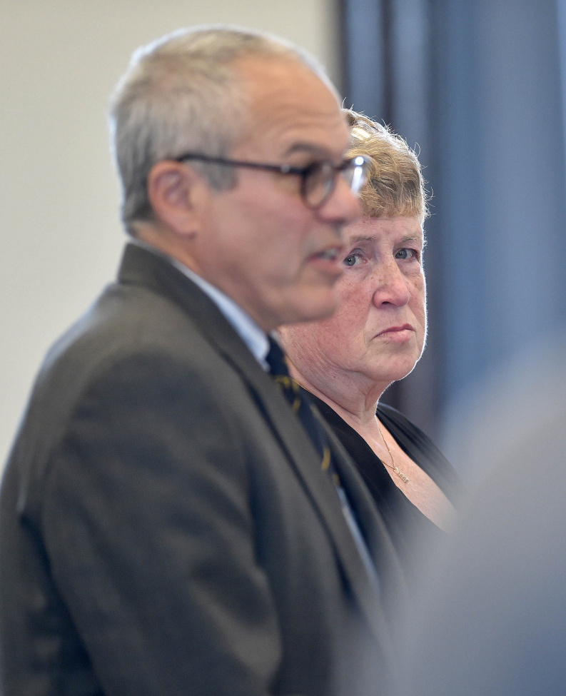 Julie Smith stands with her attorney, Woody Hanstein, in Somerset County Superior Court in Skowhegan in May, when she pleaded guilty to embezzling more than $90,000 from the Somerset County District Attorney's Office.
