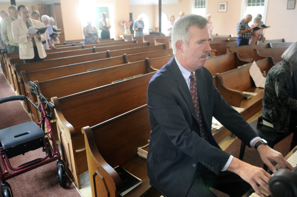 Mark Johnston plays the organ during Sunday service last summer at the Bunker Hill Baptist Church in Jefferson.  He started playing the organ at the church when he was 14.