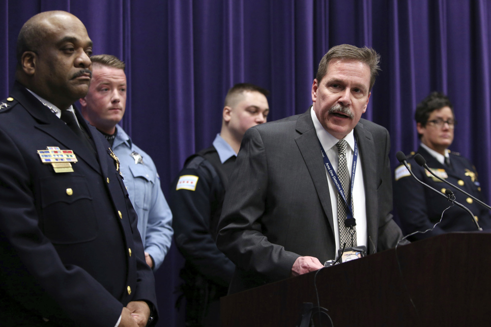 Chicago police Cmdr. Kevin Duffin speaks during a news conference Thursday about charges filed against four individuals for an attack on a man that was broadcast on a Facebook video. Chicago police Superintendent Eddie Johnson is at left.