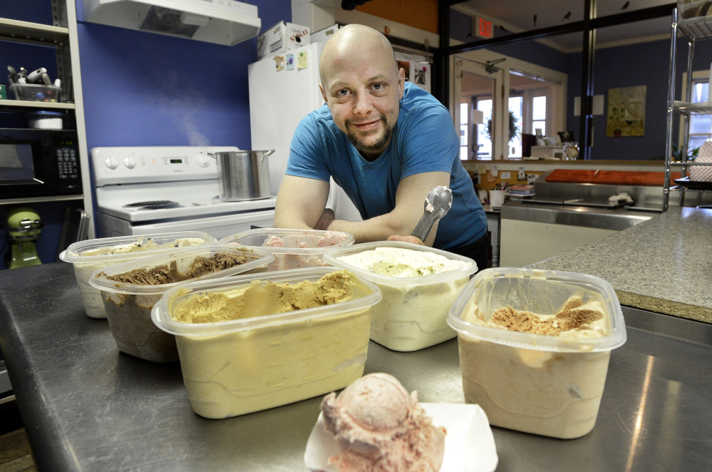 Andrew Warren displays some of the ice cream flavors served at the Catbird Creamery in Westbrook in 2014.