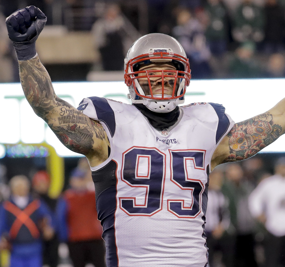 New England defensive end Chris Long (95) reacts after recovering a fumble by the New York Jets during the fourth quarter of an NFL football game, Sunday, Nov. 27, 2016, in East Rutherford, N.J. The Patriots won 22-17. ()
