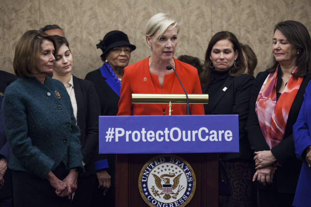 Planned Parenthood President Cecile Richards, center, House Minority Leader Nancy Pelosi, D-Calif., left, and Rep. Diana DeGette, D-Colo., right, discuss Republican efforts to defund the organization at a news conference Thursday in Washington.