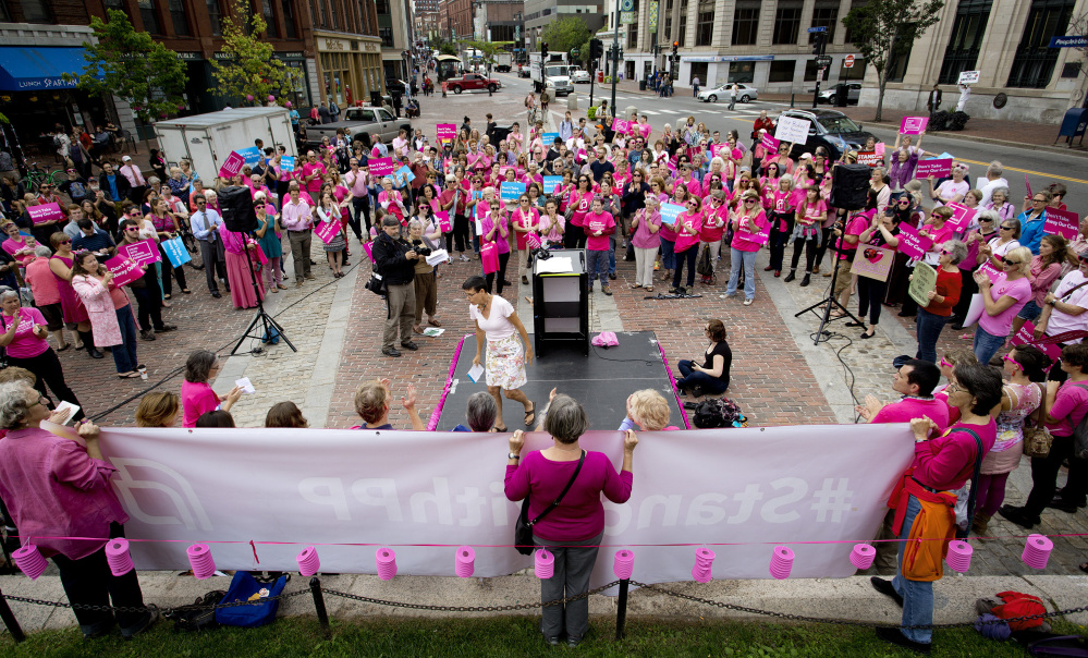 Planned Parenthood has many supporters, like these who attended a 2015 rally in Portland, but its critcs in Congress won't give up their effort to cut funding.