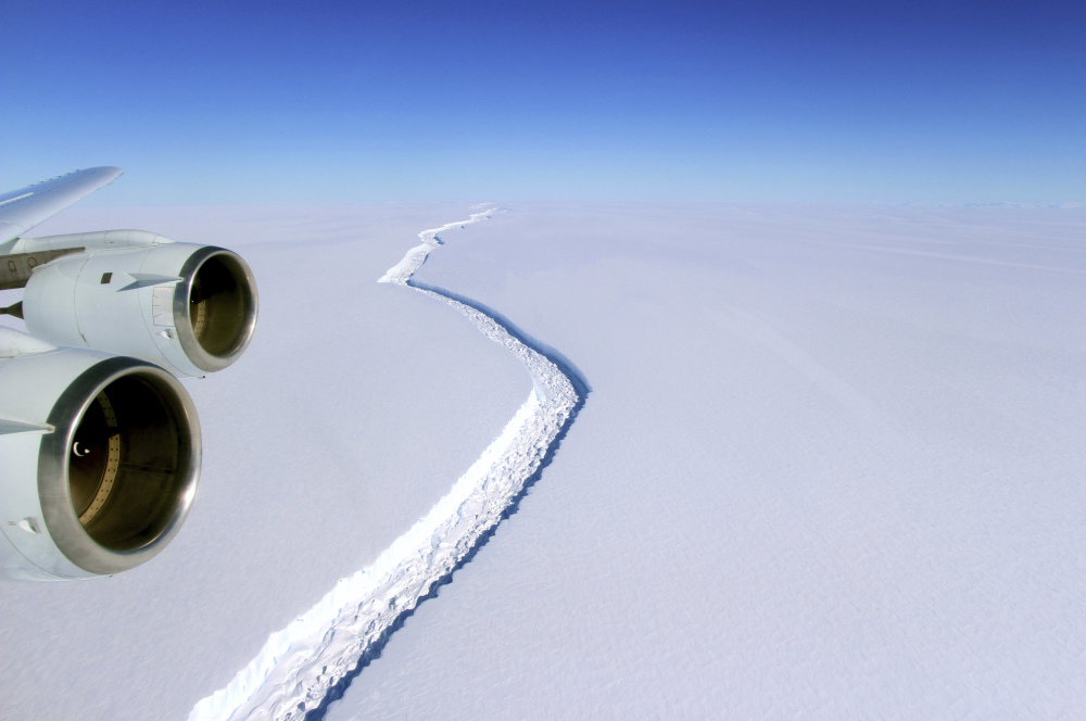 This aerial photo released by NASA shows a rift in the Antarctic Peninsula's Larsen C ice shelf. According to NASA, IceBridge scientists measured the fracture at 70 miles long.