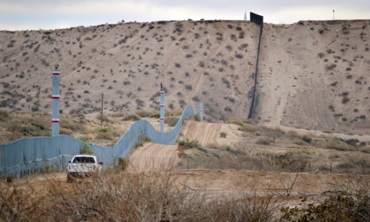 A U.S. Border Patrol agent drives near the U.S.-Mexico border fence in Sunland Park, N.M. Republicans in Congress seem amenable to building a wall Donald Trump promised during the campaign – even if Americans have to pay for it.