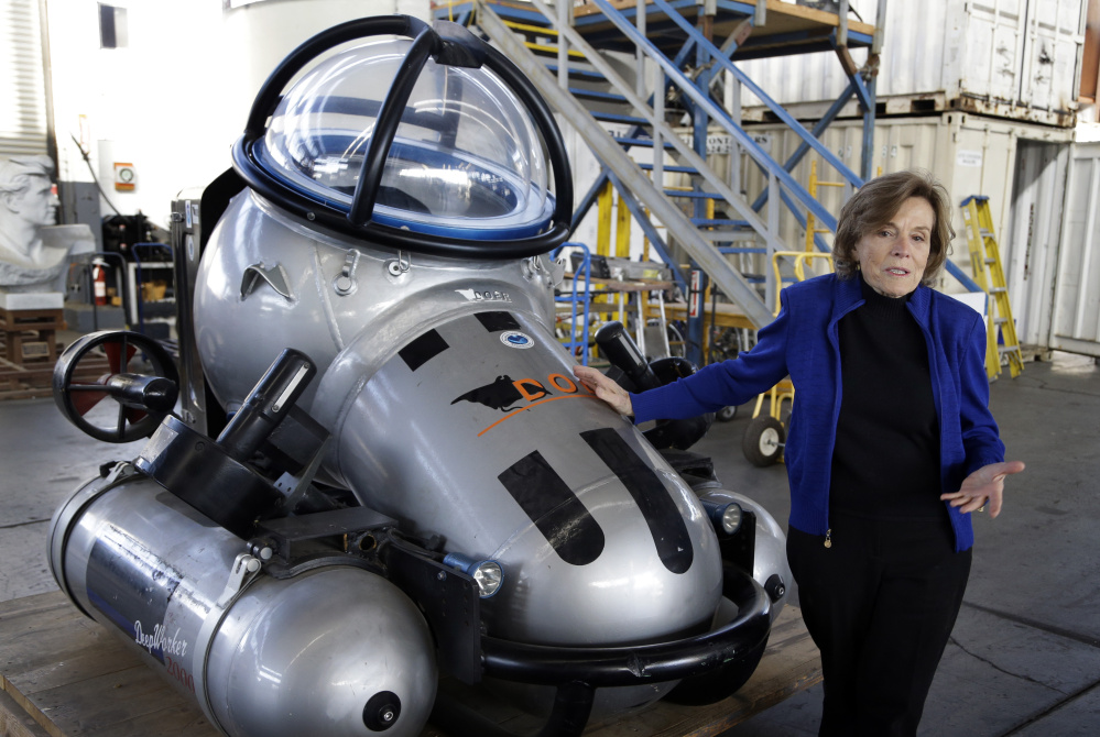 Sylvia Earle, former NOAA chief scientist and the founder of ocean advocacy group Mission Blue, shows off a full-size replica of the Deep Water 2000 submersible at Deep Ocean Exploration and Research Marine in Alameda, Calif., last month. She says aquaculture offers environmentally sustainable and economically viable options.