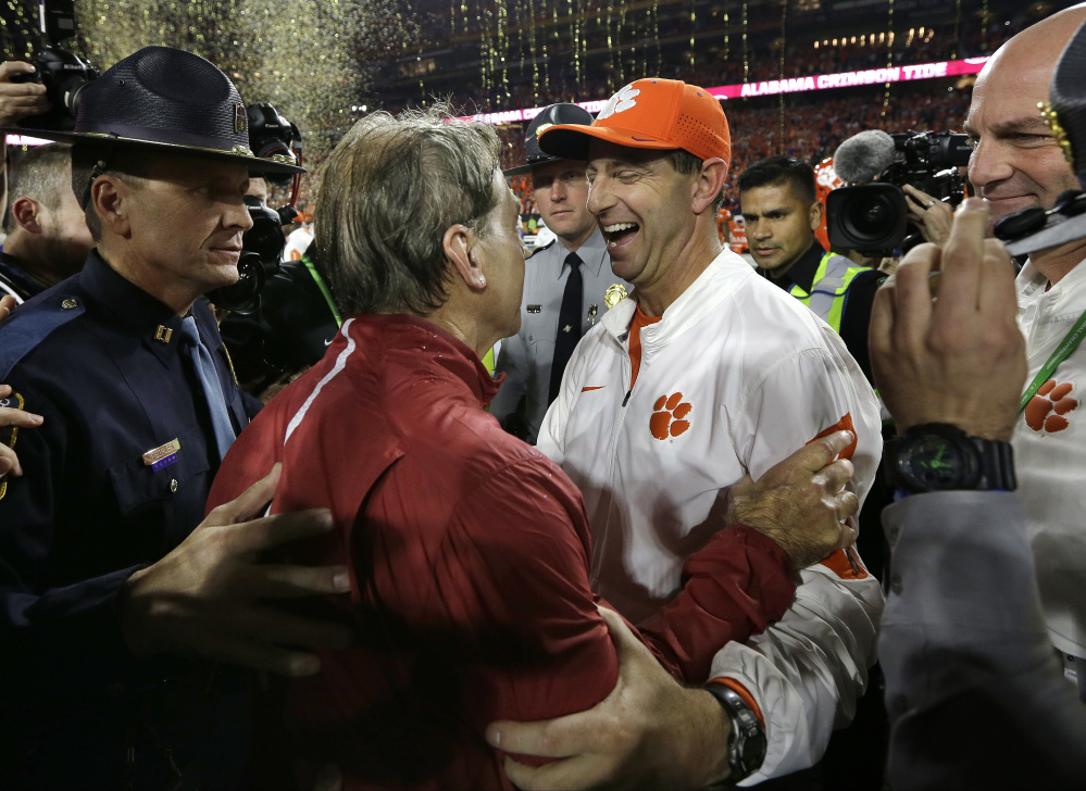 A year ago, Clemson Coach Dabo Swinney, right, congratulated Alabama's Nick Saban after the Crimson Tide won another national championship. The two coaches and their teams meet again Monday night in Tampa, Fla., with the College Football Playoff title on the line once more.
