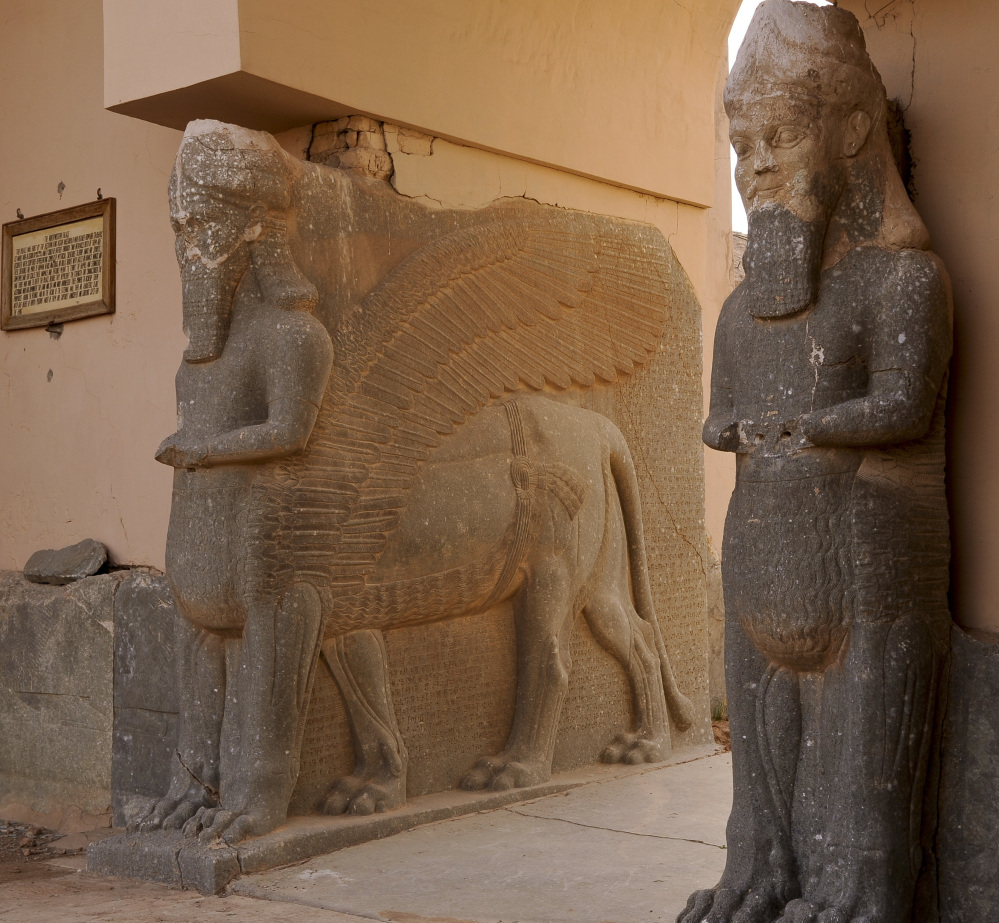Iraqi archaeologist Layla Salih, left, examines the remains of a statue of a mythical winged bull, destroyed at Nimrud, Iraq. She documents the rubble, urging for protection of pieces to ultimately restore the site, which is unguarded against looting. At right, is a 2008 U.S. Army photo showing the intact winged bull that stood at the palace gates to ward off evil.