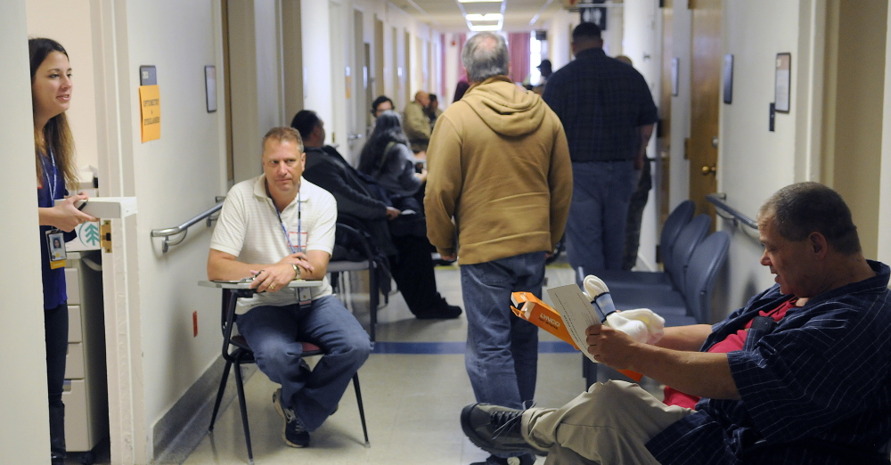 Veterans line up to receive medical care during the 17th Homeless Veterans Stand Down at the Togus VA in October 2014. New programs have made housing possible for vets in Maine.