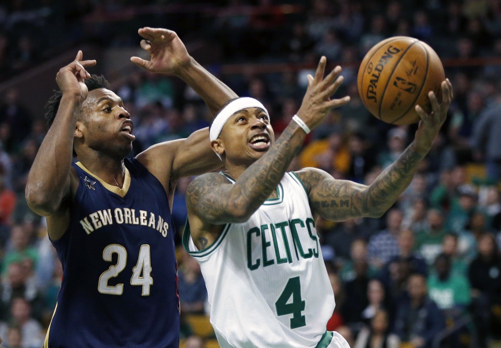 Boston Celtics' Isaiah Thomas (4) goes up to shoot in front of New Orleans Pelicans' Buddy Hield (24) during the first quarter of an NBA basketball game in Boston, Saturday, Jan. 7, 2017. (AP Photo/Michael Dwyer)