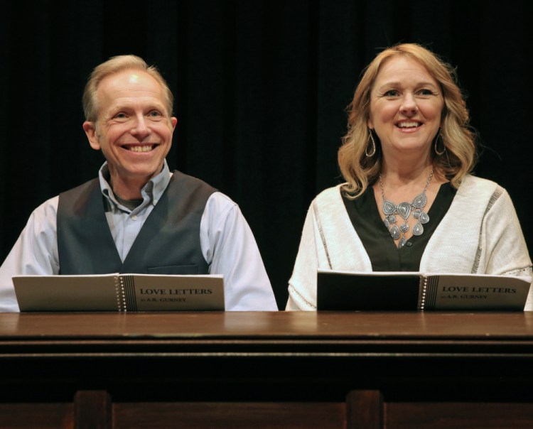 Brian P. Allen, as Andrew, and Kathleen Kimball, as Melissa, sit side-by-side at a table at center stage for the 75-minute show, reading excerpts from a lifetime of postal communications their characters have shared.