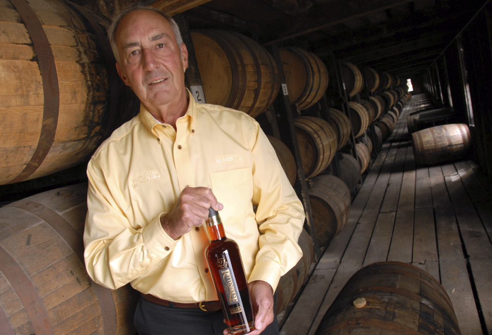 Heaven Hill's master distiller Parker Beam holds a bottle of Rittenhouse Rye Whisky made at the Bardstown, Ky., distillery in 2006. Beam, who carried on his family's historic bourbon-making tradition, died Monday at age 75 after battling Lou Gehrig's disease.