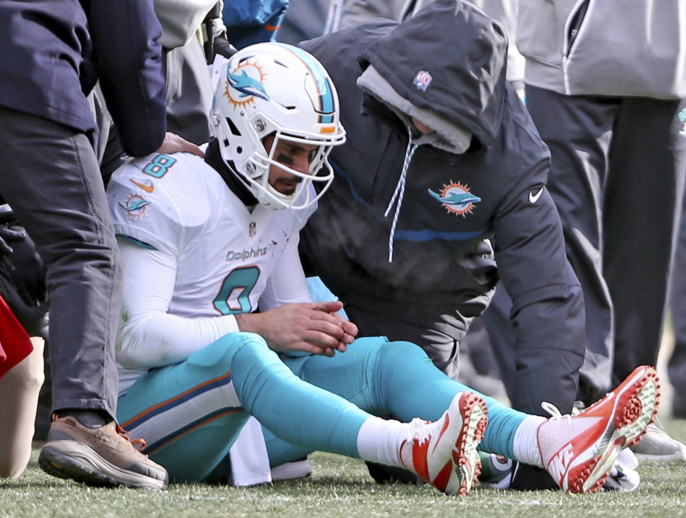 Dolphins quarterback Matt Moore only missed one play after taking a helmet to the chin during Miami's 30-12 loss to Pittsburgh in the first-round of the playoffs Sunday.