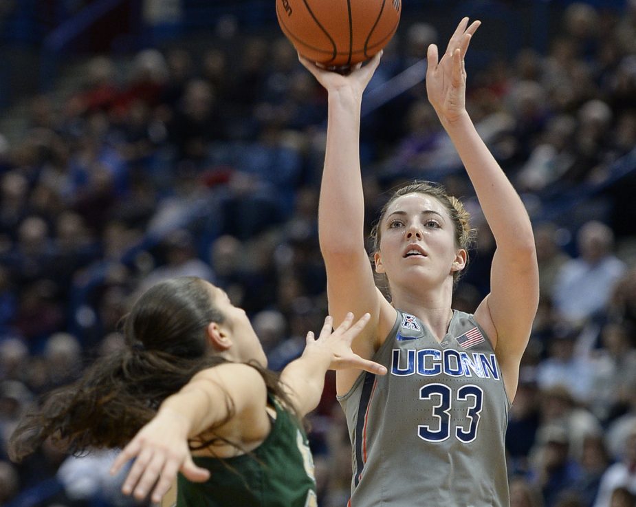 Connecticut's Katie Lou Samuelson shoots over South Florida's Laia Flores in the first half Tuesday night in Hartford, Conn. The Huskies won their 90th straight, 102-37.