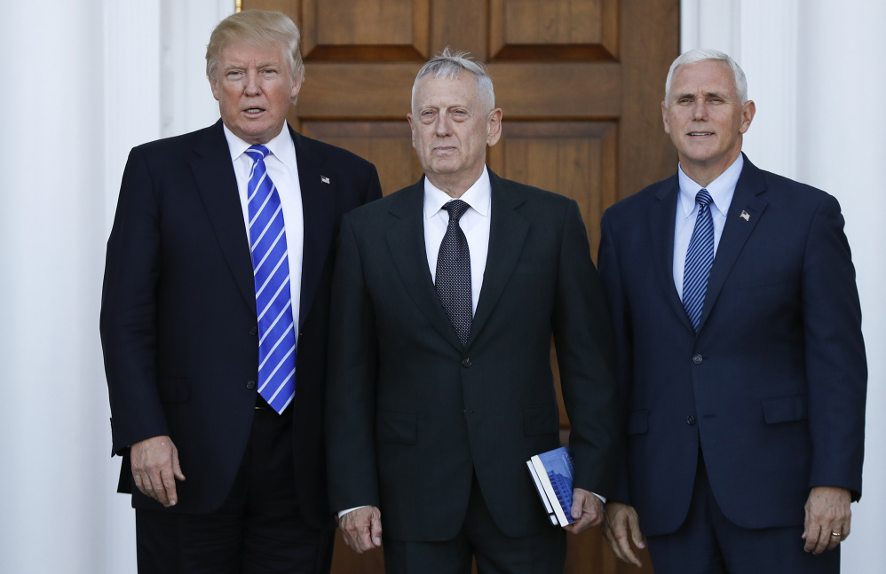 President-elect Donald Trump and Vice President-elect Mike Pence with retired Marine Corps Gen. James Mattis. Mattis Thursday contradicted Trump on some key military issues.