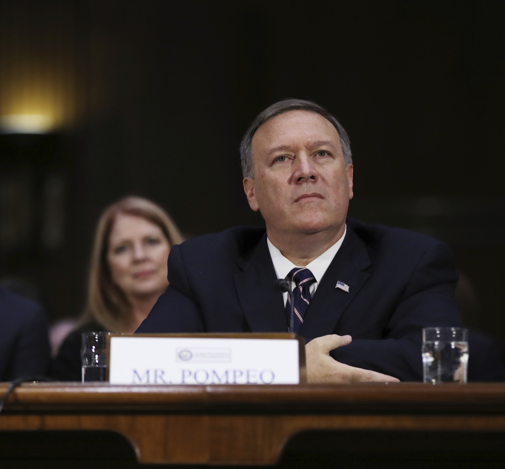 CIA Director-designate Rep. Michael Pompeo at his confirmation hearing before the Senate Intelligence Committee Thursday. Seated behind Pompeo is his wife Susan Pompeo.