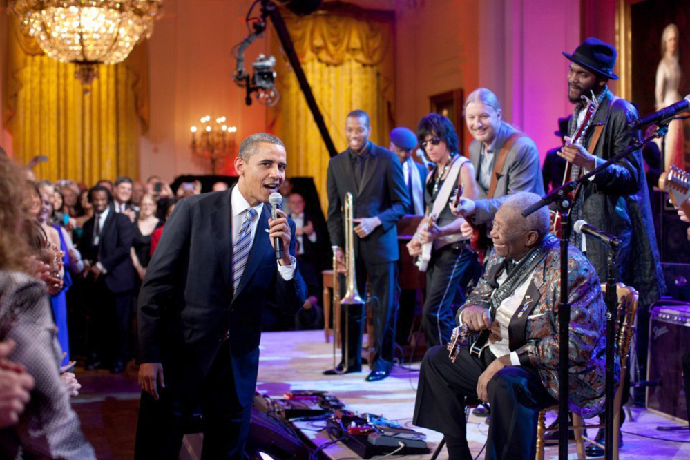 President Obama joins in singing "Sweet Home Chicago" during a concert in the East Room of the White House on Feb. 21, 2012. (White House photo by Pete Souza)