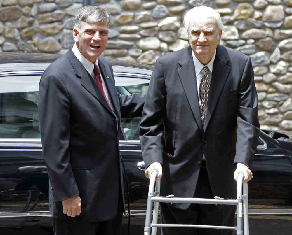 Billy Graham, right, arrives with his son, Franklin Graham, for a memorial service for Ruth Graham in Montreat, N.C., in 2007.
