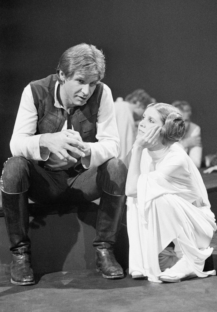 Harrison Ford chats with Carrie Fisher in 1978. Filmmakers said they have no plans to digitize Fisher in future films. (Associated Press/George Brich)