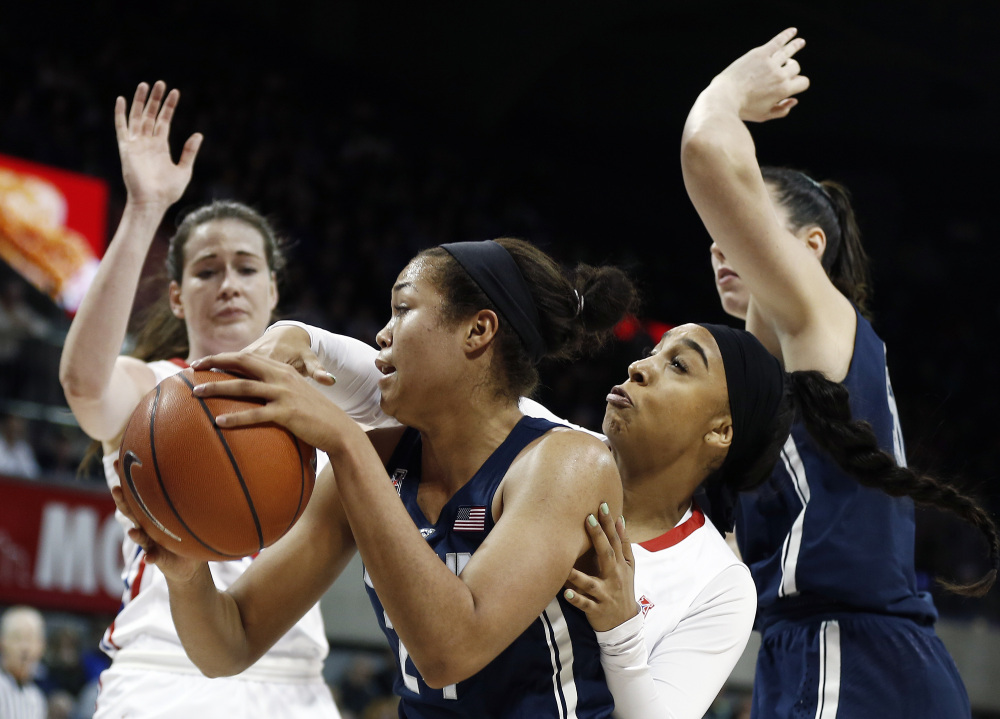 Connecticut forward Napheesa Collier, center, battles SMU guard Devri Owens, second from right, during the first half of an NCAA college basketball game, Saturday, Jan. 14, 2017, in Dallas. (Associated Press/Brandon Wade)