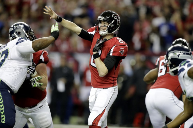 Falcons quarterback Matt Ryan throws a pass in the first half of Atlanta's 36-20 win over Seattle in the NFC playoffs Saturday in Atlanta.