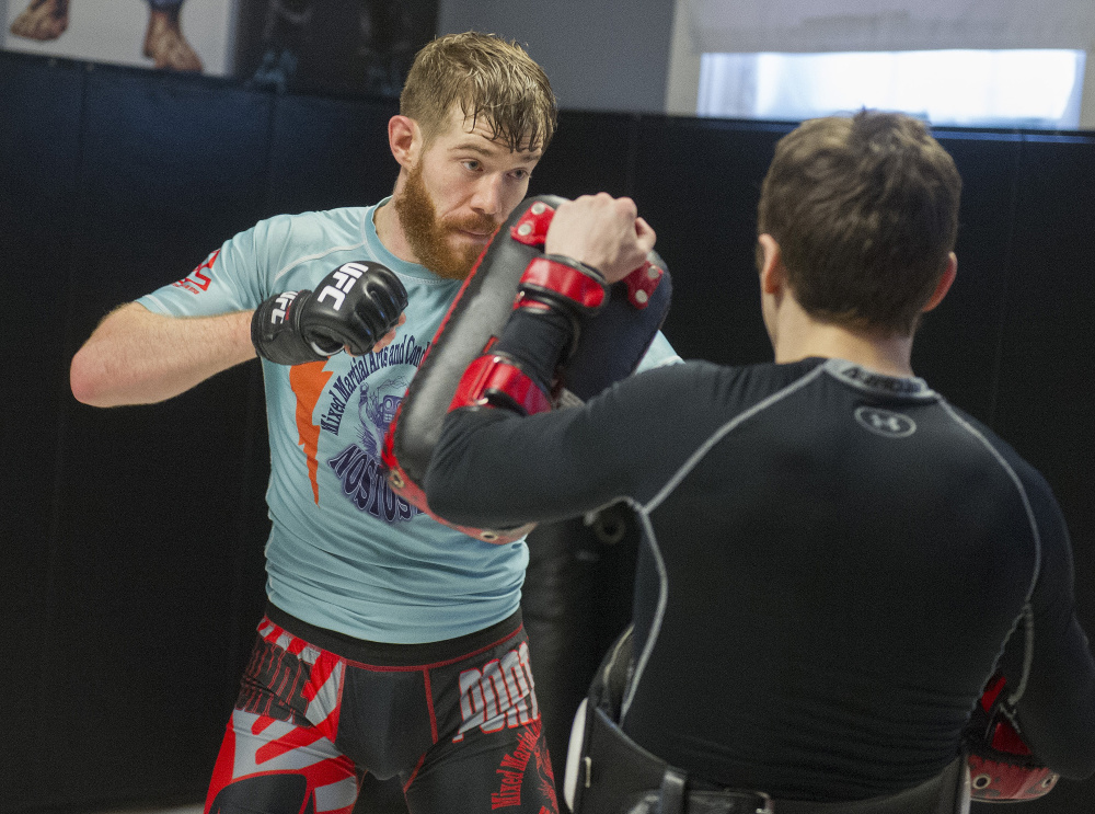 Devin Powell spars with Muay Thai teacher Tim Hagan, one his main training partners, during a recent workout at his Nostos MMA training facility in Somersworth, New Hampshire. 