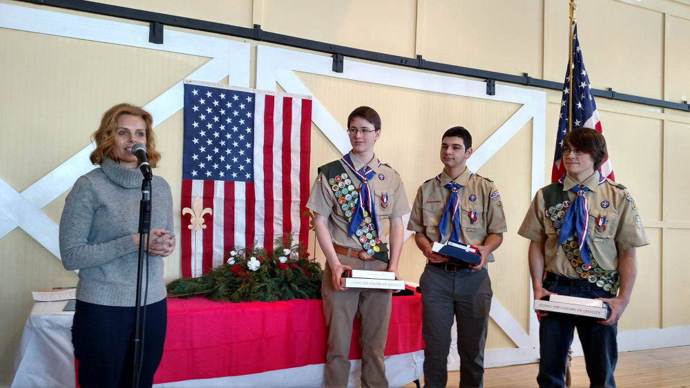 Photos courtesty Krysta West 
 CAPTION: Scarborough Eagle Scouts Presented with Flags 
 (from left)  Sen. Amy Volk, District 30, presents Boy Scouts members Jacob Murphy, Joshua Passarelli and John Hinkle with Maine state flags, that were flown over the State House, to honor their achievement of attaining the high rank of Eagle Scout. All three scouts are from Scarborough and members of Troop 39.