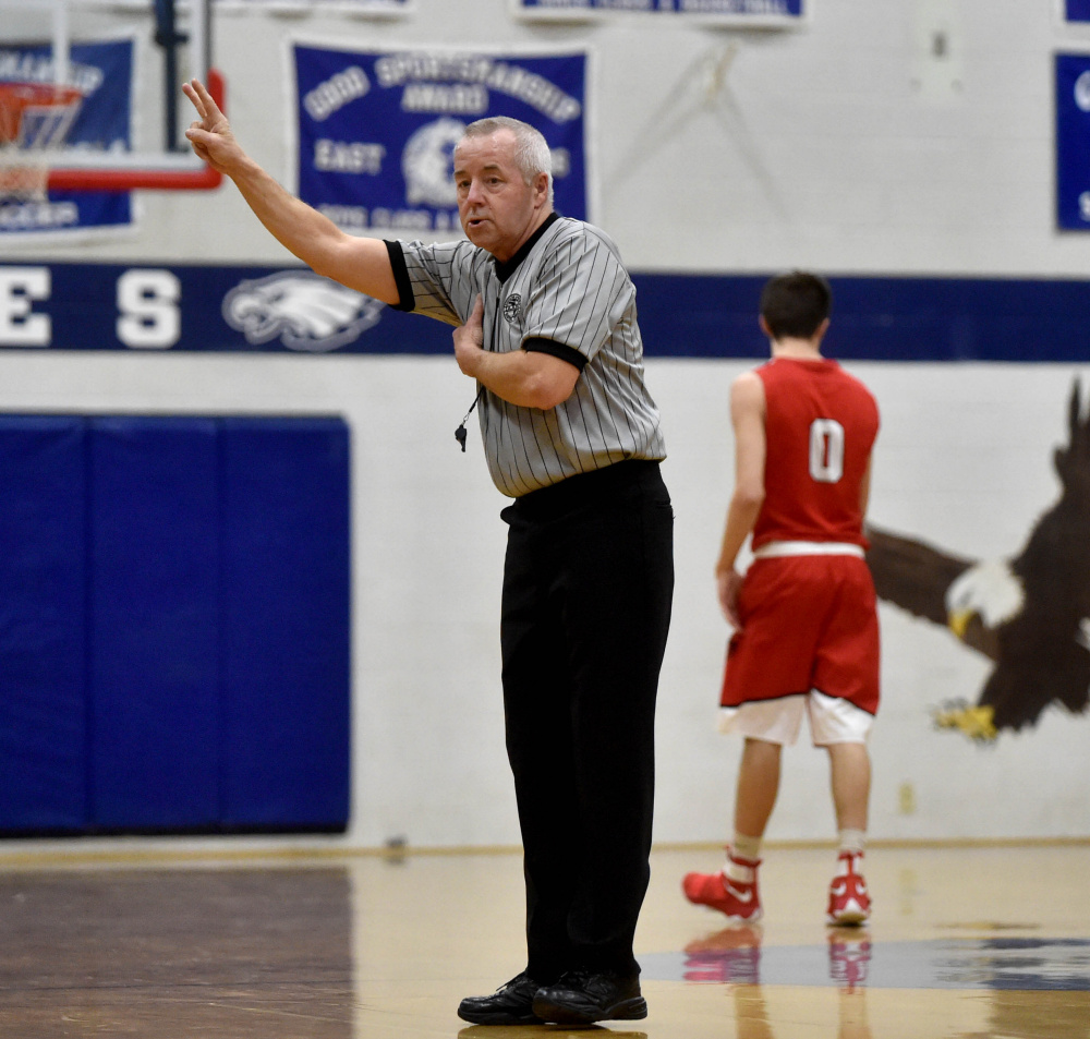 Rocky Buck officiates a game between Cony High School and Messalonskee High School on Saturday in Oakland.