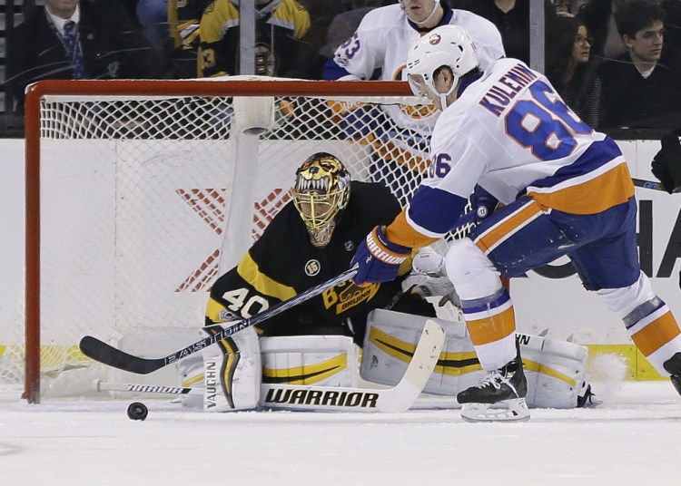 Nikolay Kulemin of the Islanders scores one of his two goals against Bruins goalie Tuukka Rask during a 4-0 victory Monday afternoon at TD Garden.