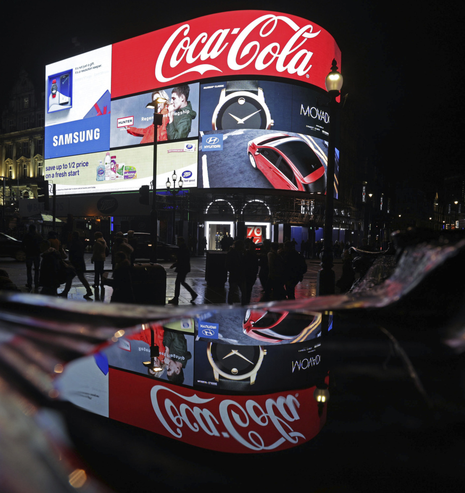 A general view of the advertising screens at Piccadilly Circus, central London, Sunday Jan. 15, 2017, before they were switched off in preparation for redevelopment. The iconic lights have gone out so that the electronic hoardings can be replaced with a state-of-the-art screen measuring 790 square metres which is expected to be unveiled in the autumn.  ()