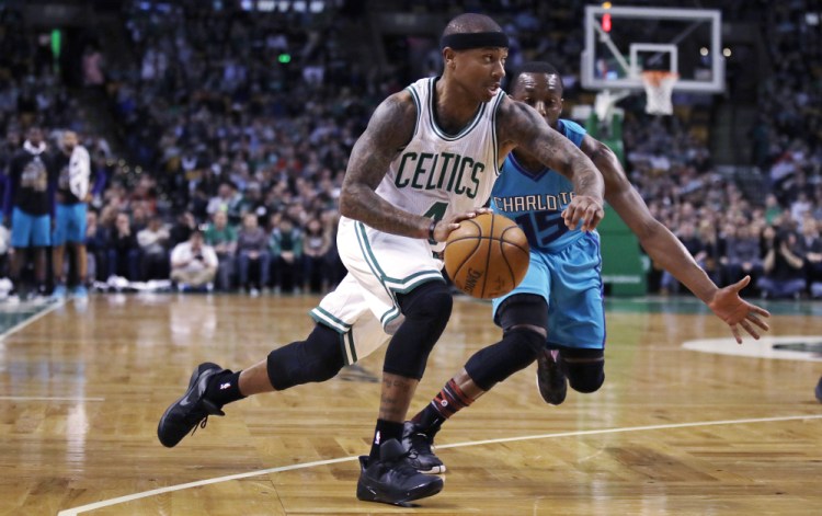 Celtics guard Isaiah Thomas drives to the basket past Charlotte guard Kemba Walker in the first quarter of Monday night's game in Boston. Once again, Thomas was the Celtics' go-to guy in the fourth quarter.