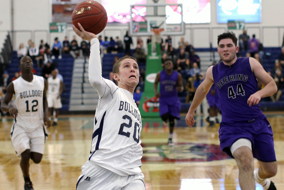 Griffin Foley takes a shot on a fast break during Portland's 64-44 win over Deering on Tuesday. Foley scored 20 points to help the Bulldogs improve to 10-1.