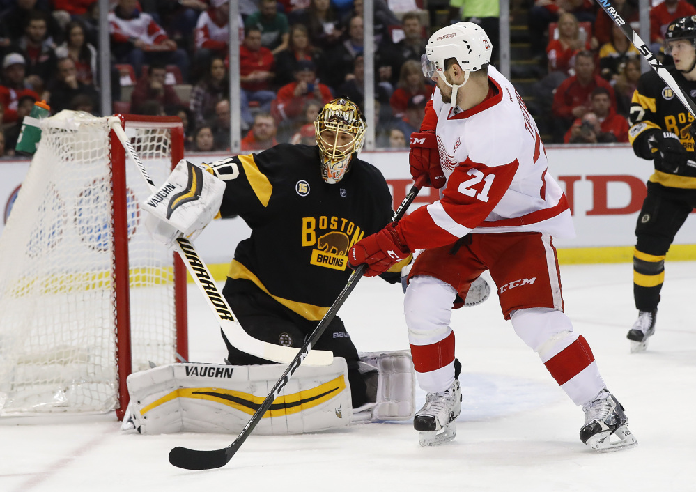 Bruins goalie Tuukka Rask stops a shot by Detroit's Tomas Tatar in the first period Wednesday night in Detroit.