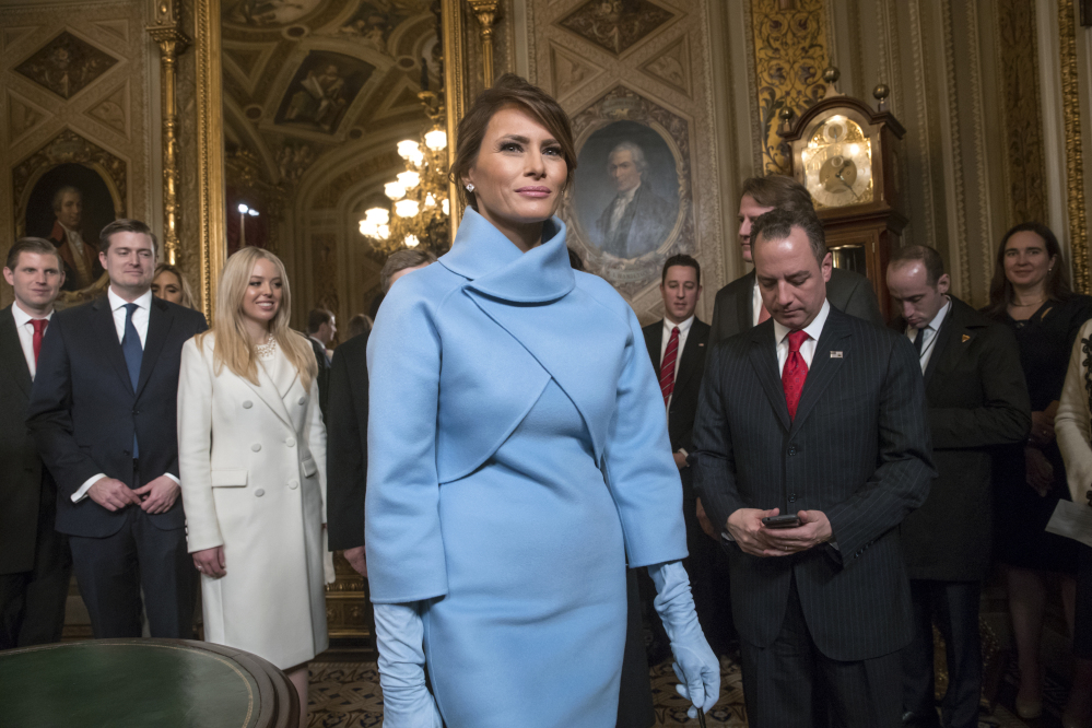 Melania Trump leaves the President's Room of the Senate at the Capitol on Friday after President Trump signed his first legislation. The new White House website lists the brand names of Melania Trump's jewelry lines sold on QVC.