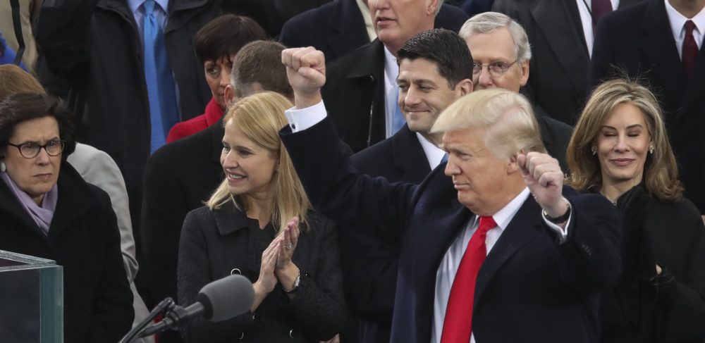 President Donald Trump pumps his fists in the air after his speech during the 58th presidential inauguration at the U.S. Capitol in Washington on Friday.
