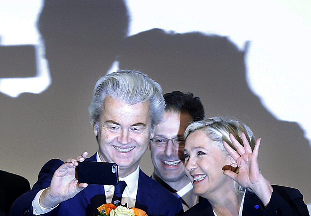 Far-right leader and candidate for next spring's presidential elections Marine Le Pen from France, right, and Dutch populist anti-Islam lawmaker Geert Wilders pose after their speeches during a meeting of European nationalists in Koblenz, Germany, on Saturday.
Associated Press/Michael Probst