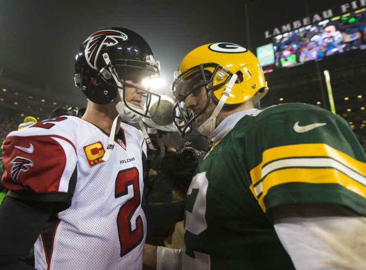 Atlanta quarterback Matt Ryan, left, and Green Bay quarterback Aaron Rodgers are expected to put on a offensive show when they play for the NFC championship Sunday in Atlanta.