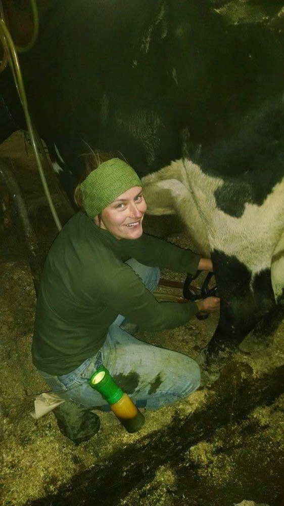 Sarah Smith of Grassland Organic Farm in Skowhegan gets ready to milk a cow in a recent photo. Smith, the former manager of the Skowhegan Farmers' Market, will be among the speakers Jan. 29 at the annual Maine Farmers' Market Convention.