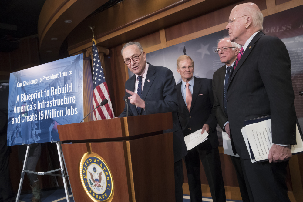 From left, Senate Minority Leader Charles Schumer of New York, Sen. Bill Nelson, D-Fla., Sen. Bernie Sanders, I-Vt., and Sen. Patrick Leahy, D-Vt., participate in a news conference on Capitol Hill in Washington on Tuesday to offer a proposal to spend $1 trillion on infrastructure projects in an attempt to engage President Trump on an issue where they hope to find common ground.